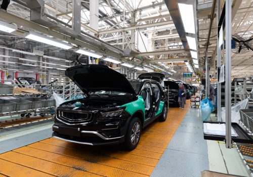 Minsk, Belarus - Dec 15, 2021: Photo of modern car assembly plant. Interior of a high-tech factory of new automobiles.